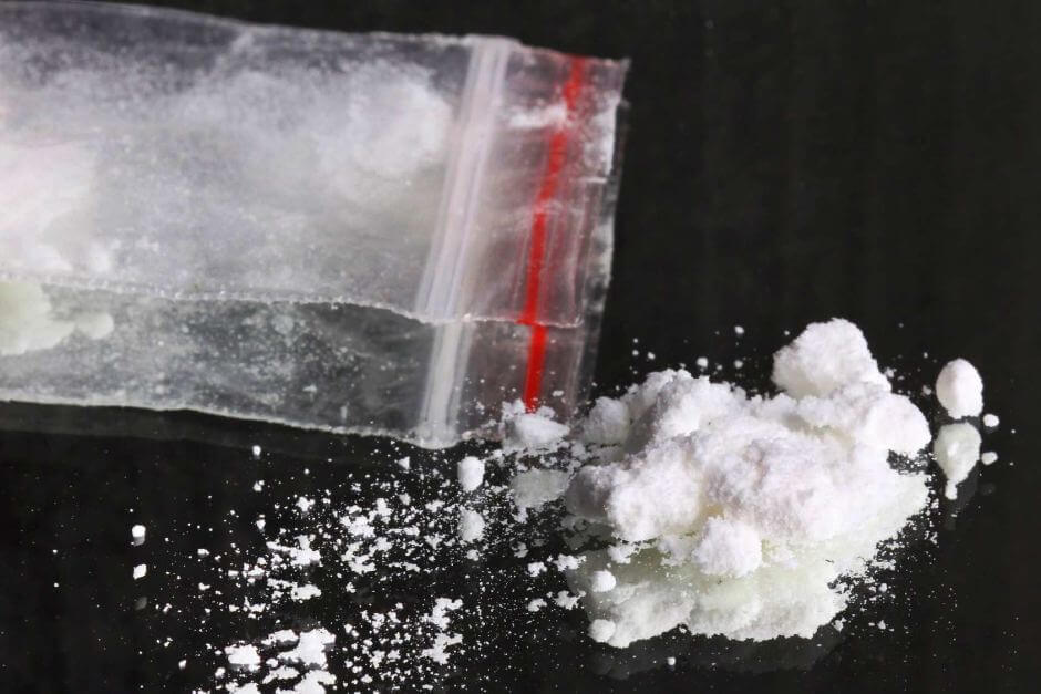 Eighteen people in custody following police raids on alleged heroin and meth dealers
