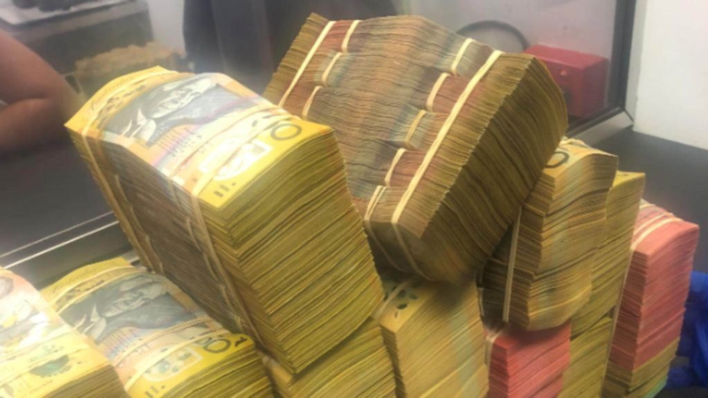 Police seize cash, drugs and weapons in transnational syndicate bust