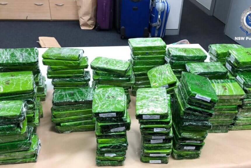 Four charged after $100m drug stash found on flight to Sydney