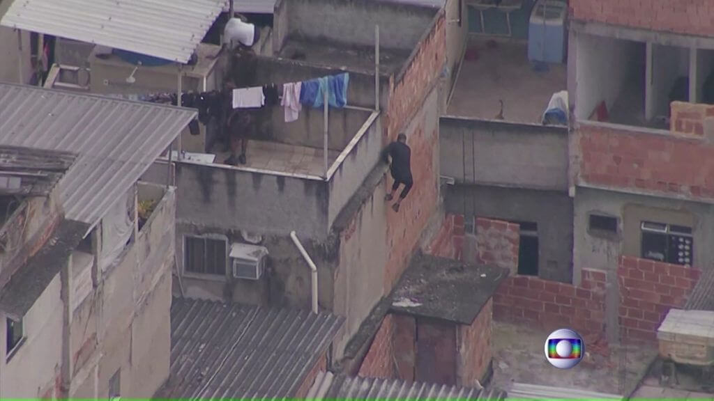 Aerial footage shows suspects trying to escape on rooftops as police entered the favela